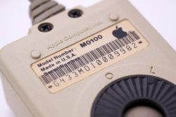 Macintosh M0100 mouse underside, two-screw version (Marcin Wichary)