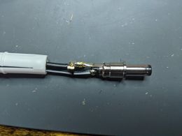 Atari Jaguar adaptor plug repair, wires soldered to the plug (James Jones)