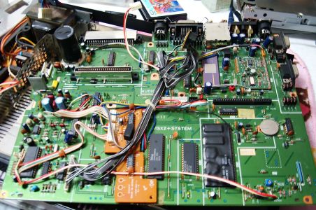 HB-F1XDJ main board, with the HIC-1 module at the rear right and the CR2032 at the right