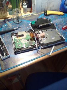 An opened Wii with the disc drive turned over to show its board (photo: Antoine Turmel, CC BY 2.0)