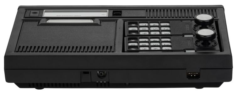 Rear: channel selector, game cable socket and, at right, the four-pin power socket (Evan-Amos, public domain)