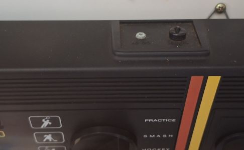 The terminal plate on the top rear, for the game cord and adaptor socket