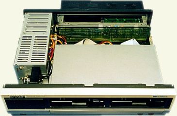 MZ-3541 opened: power supply cage on the left, MFD interface board at the back, drives under their cover (SharpMZ.net)
