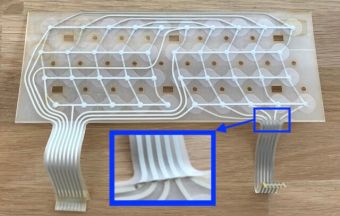 A cracked Sinclair ZX Spectrum keyboard membrane
